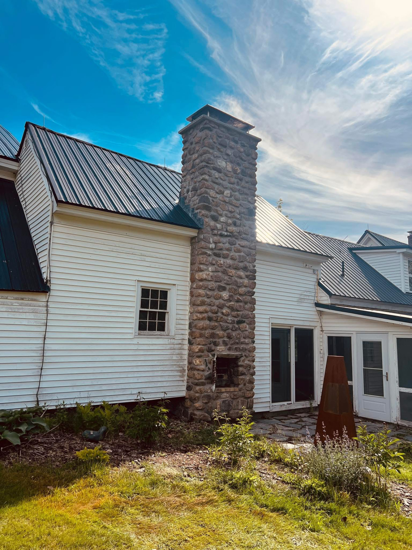 Natural stone masonry steps and retaining walls at a Maine home