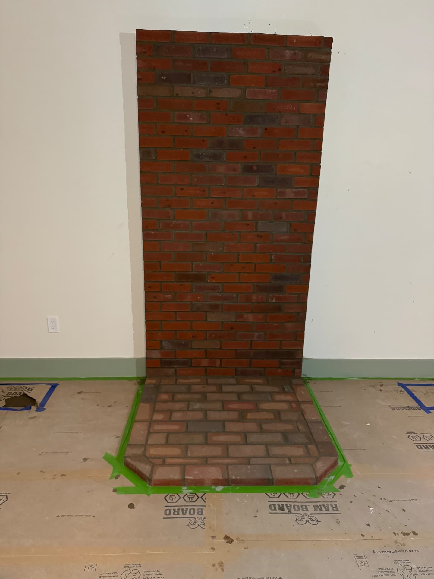 Custom red brick fireplace surround and raised hearth